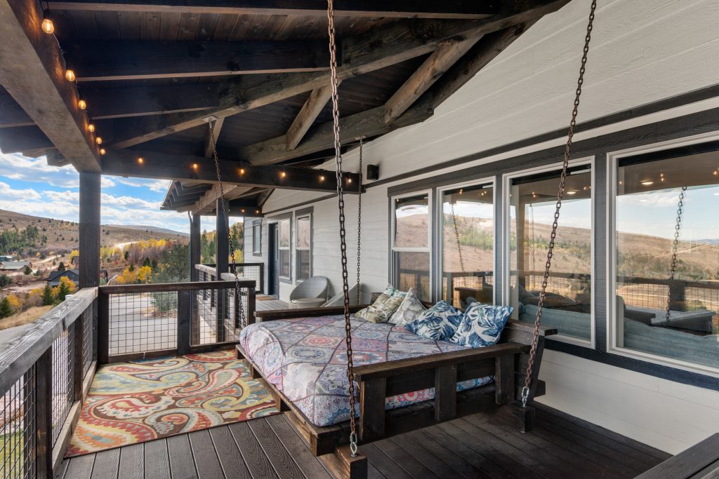 Swinging daybed on the furnished deck overlooking Bear Lake